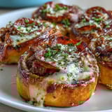 A cross-section of savory Irresistible High Protein Pepperoni Pizza Rolls revealing layers of lean beef and turkey pepperoni inside.