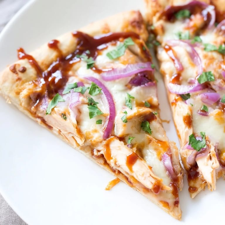 Freshly baked Chicken BBQ Pizza: Imagine the smoky barbeque flavor with every cheesy bite.