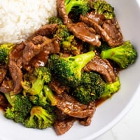 Tender beef and broccoli stir-fry glistening with a savory sauce, ready for a delicious meal.