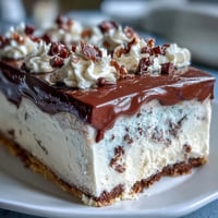 Fluffy vanilla sheet cake with creamy vanilla buttercream, decorated with festive graduation sprinkles for a celebratory dessert.  